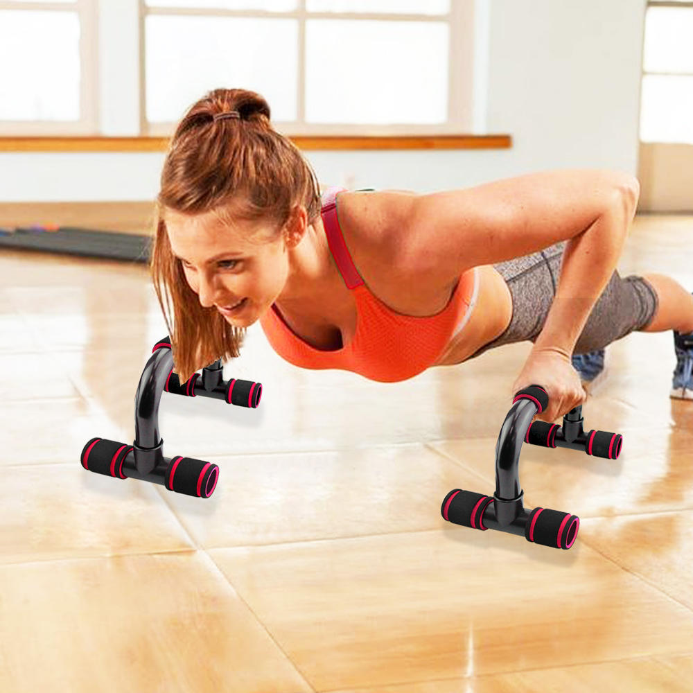 Push up bars for chest in use showing correct form for deeper chest-focused push-up exercise