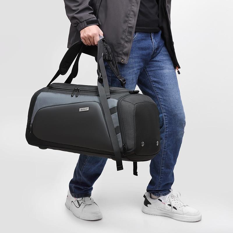 large gym bag black with separate wet dry compartments carried by hand