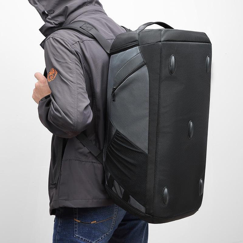 large gym bag black worn over shoulder with straps and wet dry compartments
