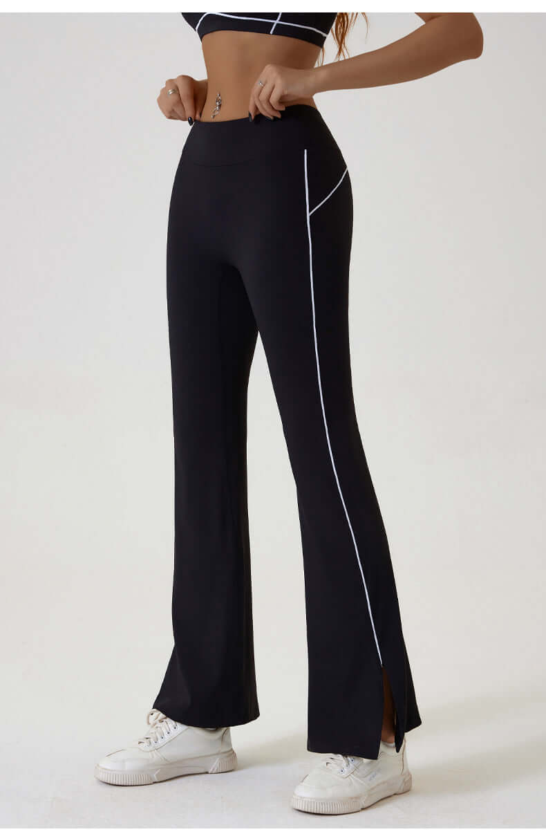Women wearing black leggings for gym featuring side slits and breathable fabric, perfect for workouts and activewear.
