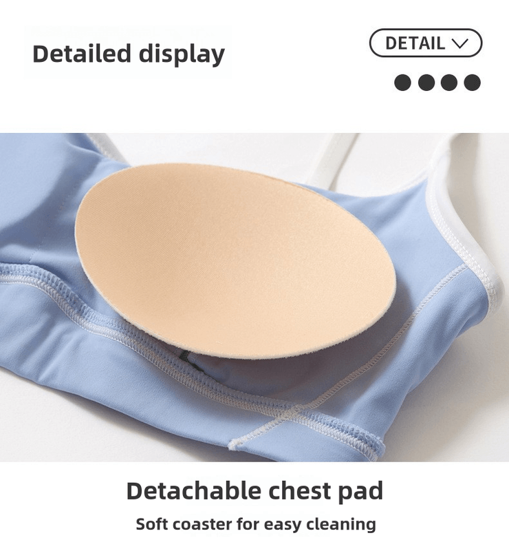 Detailed display of a detachable chest pad on a light blue bra, showcasing its soft material for easy cleaning.